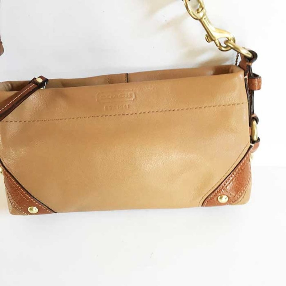 Vintage Coach tan leather hobo bag.